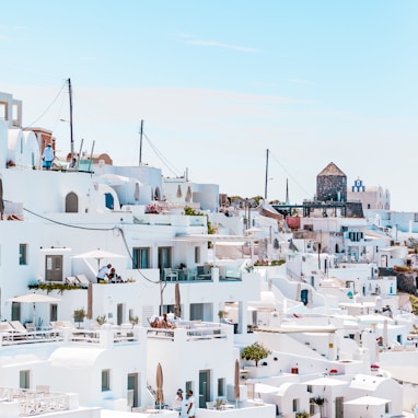 white concrete houses under blue sky at daytime