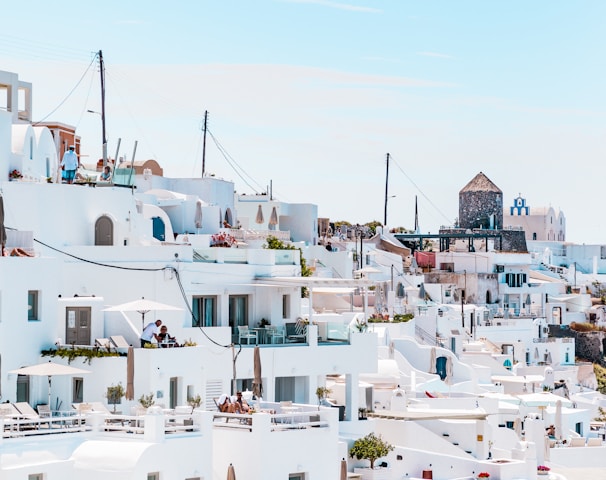 white concrete houses under blue sky at daytime