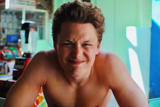 A warm portrait of Ilka Baumann smiling in a bright, modern kitchen setting.