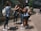 A group of young women enjoying a sunny day outdoors, dressed in trendy outfits.