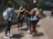 A group of young women enjoying a sunny day outdoors, dressed in trendy outfits.
