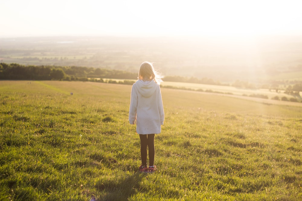 woman standing on green grass