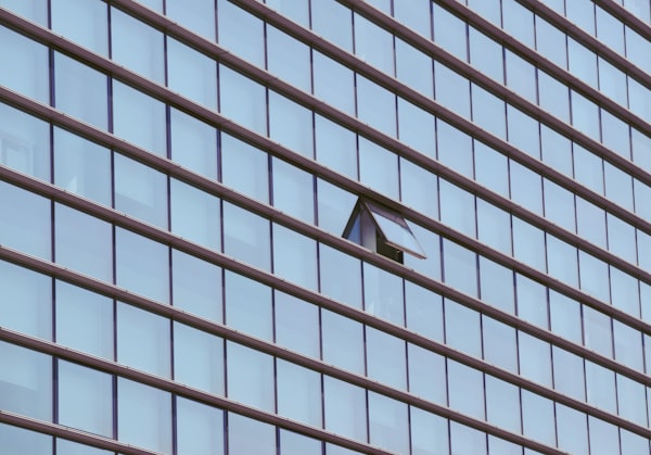 An opened window in an corporate building