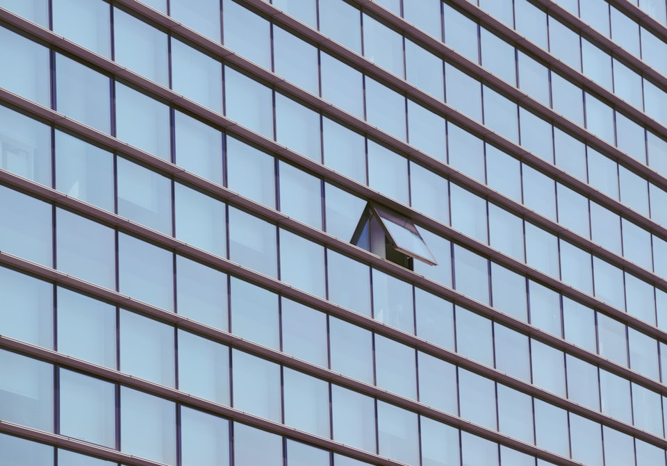 An opened window in an corporate building