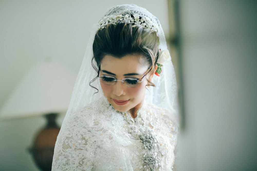 woman wearing white lace top with veil