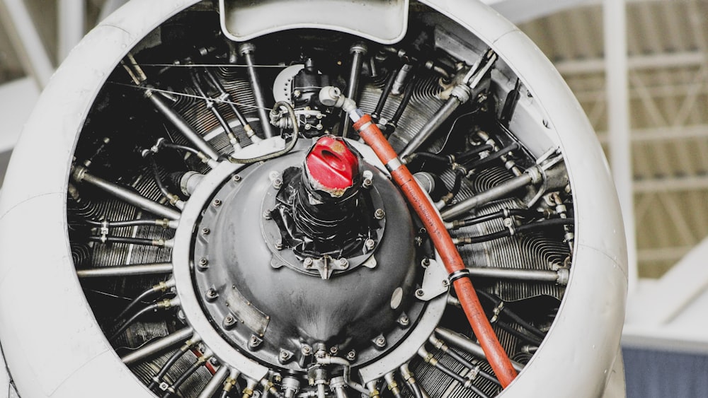 closeup photo of gray and white engine part