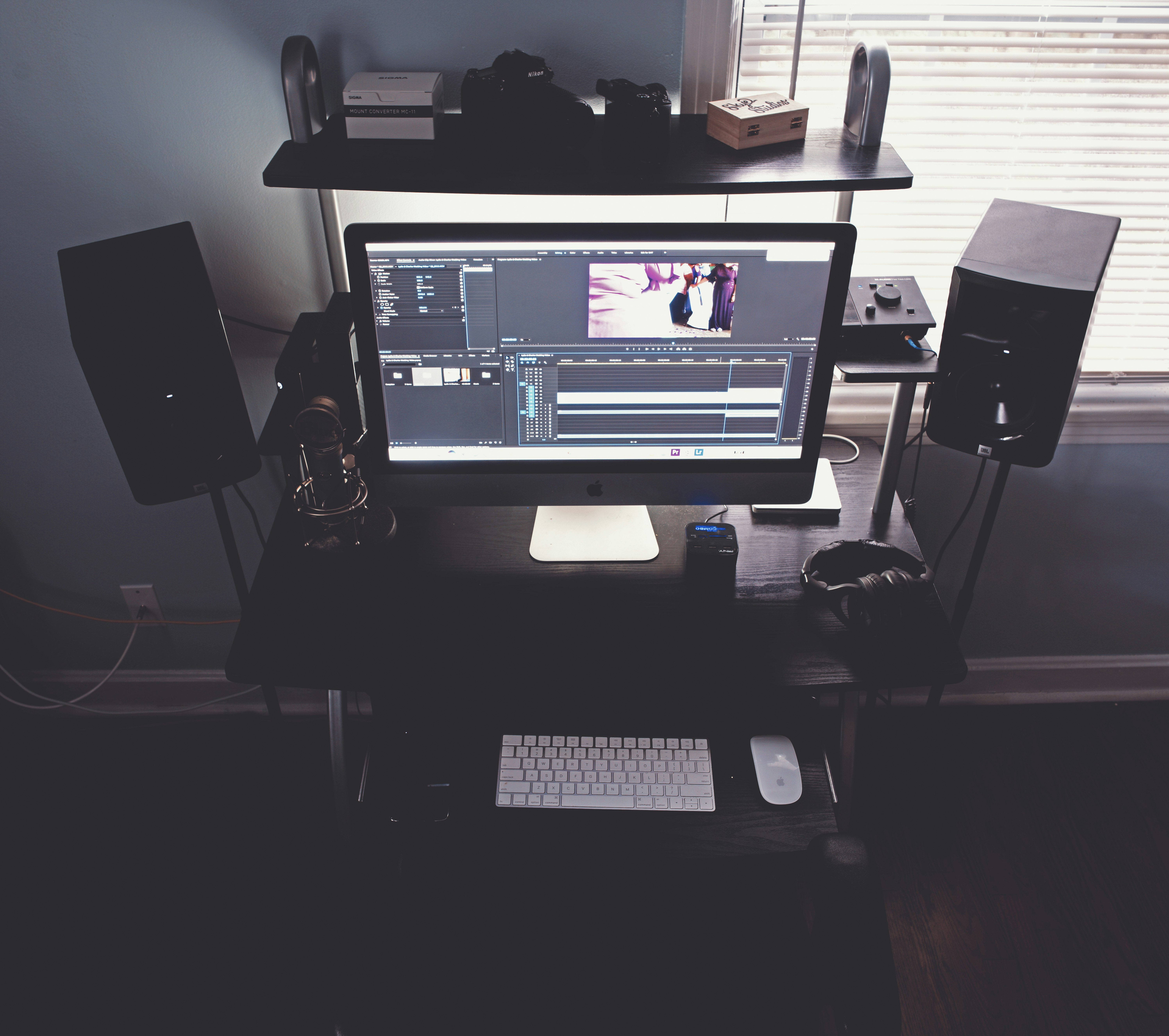 black flat screen computer monitor on black wooden desk