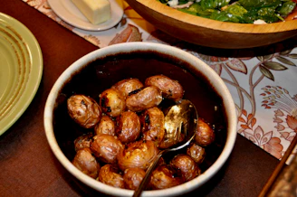 A vibrant spread of smashed baby potatoes and ancient grain salad served in earthy bowls.