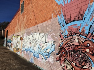 An artistic photo of a mural painted on a brick wall, showcasing local creativity.