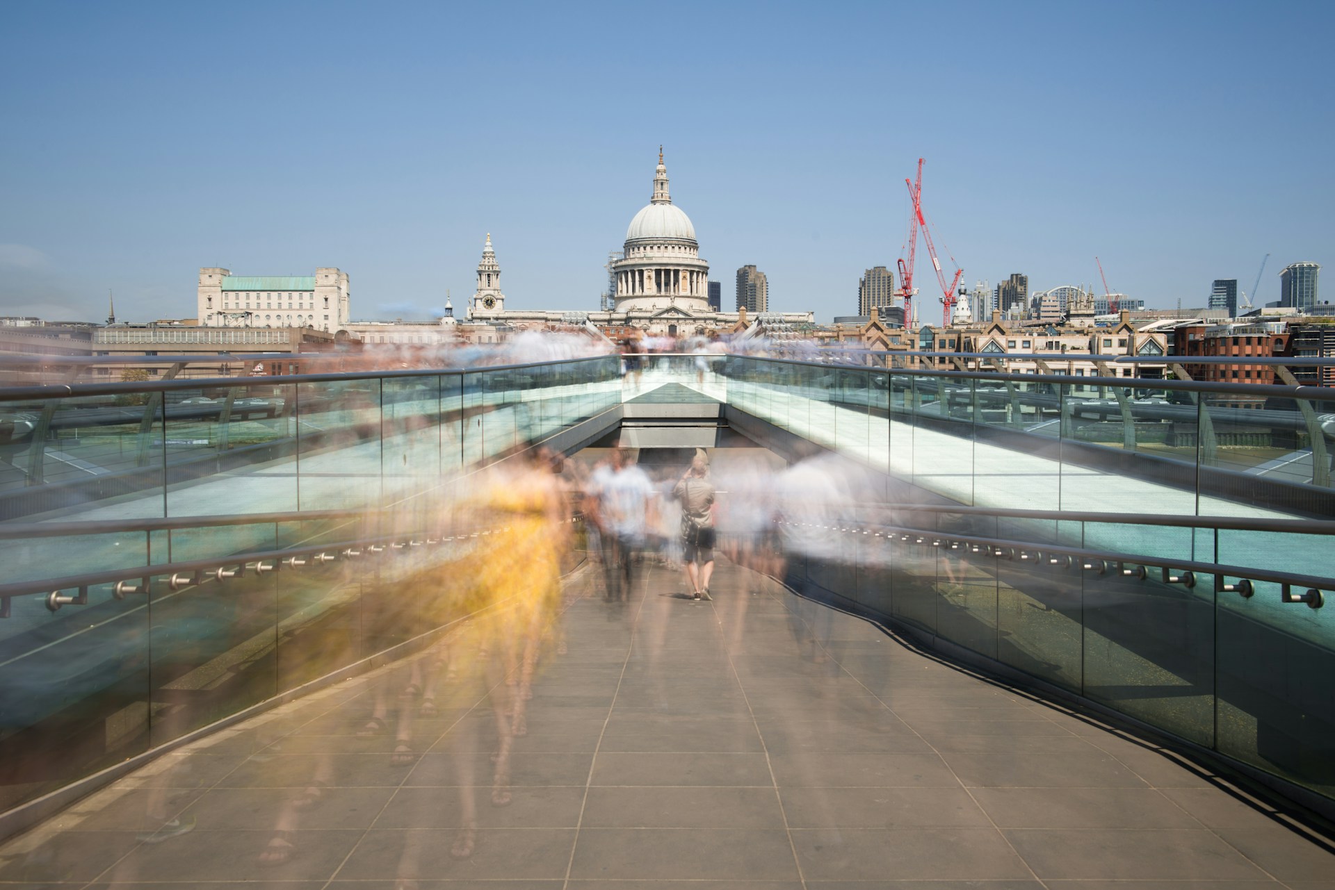 time-lapse photography of people walking on concrete pavement