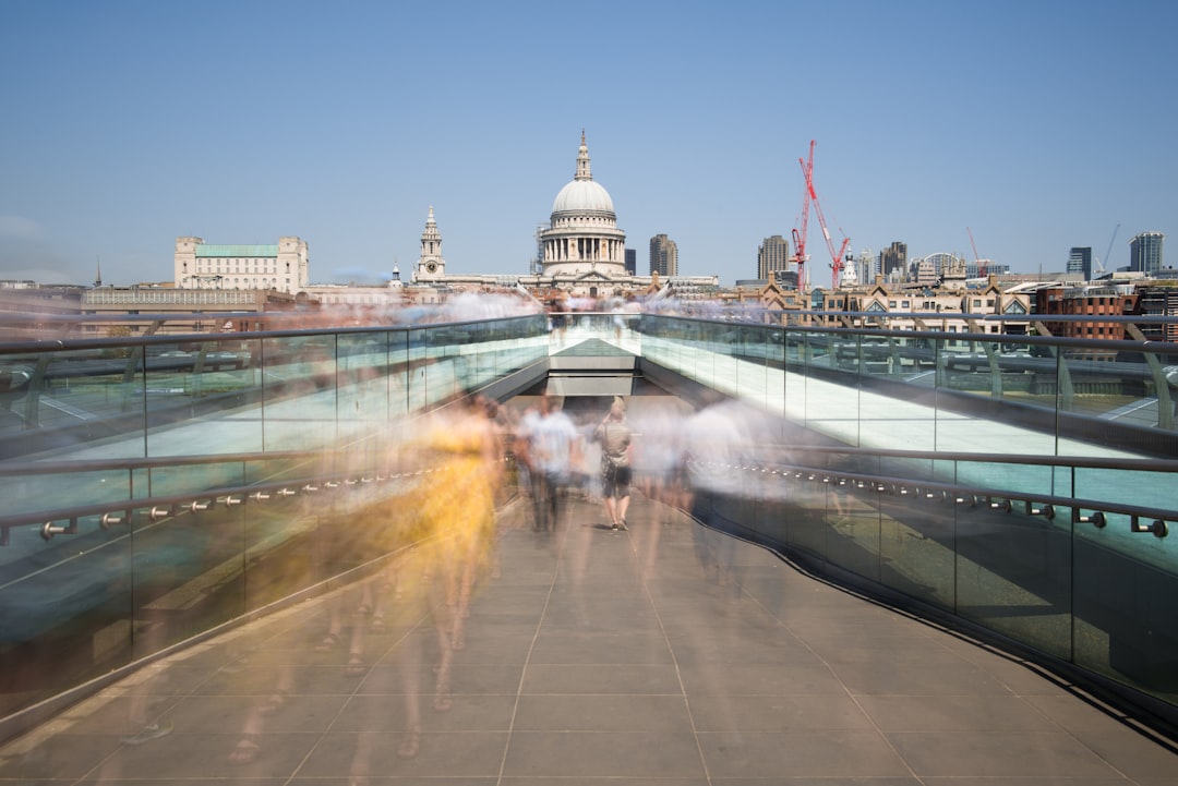 time-lapse photography of people walking on concrete pavement, I’ve always wanted to photograph the Millennium Bridge. Numerous posts on Instagram made it seem like a fascinating destination - especially at sunrise and sunset. The only issue? The sun rose far to early in the morning and too many people were around at golden hour.<p></figure>With that in mind, I decided to try something a bit different using a ND filter.