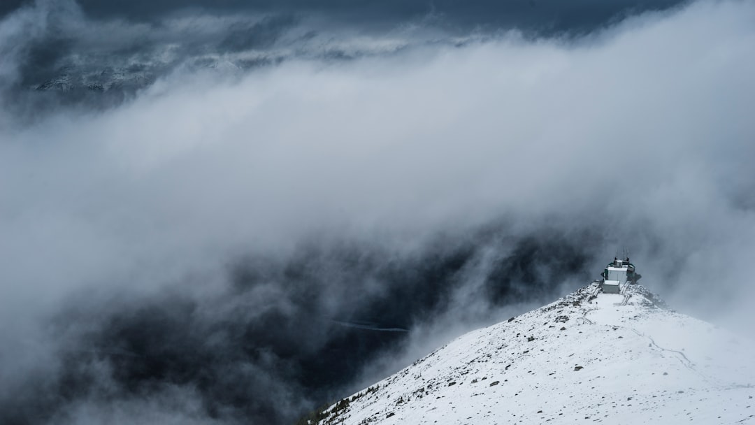 white mountain under white clouds at daytime