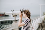 woman using telescope