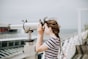 woman using telescope