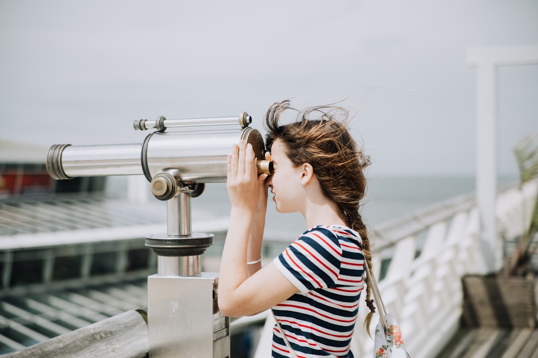 looking through binoculars