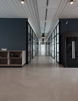 architectural photography of black and brown hallway