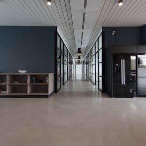 architectural photography of black and brown hallway