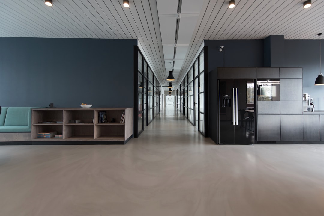 architectural photography of black and brown hallway