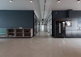 architectural photography of black and brown hallway