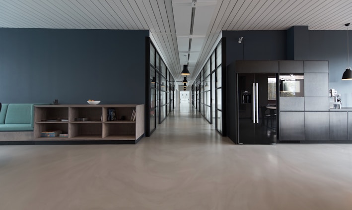 architectural photography of black and brown hallway