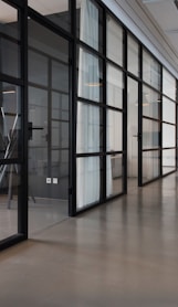 hallway between glass-panel doors