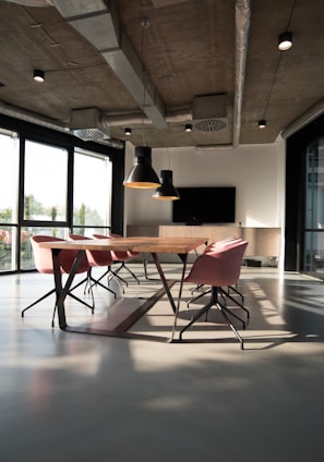 photo of dining table and chairs inside room