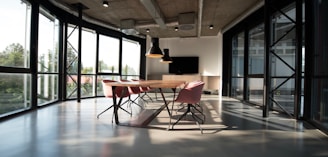 photo of dining table and chairs inside room