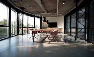 photo of dining table and chairs inside room