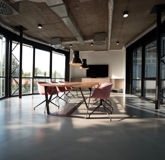 photo of dining table and chairs inside room