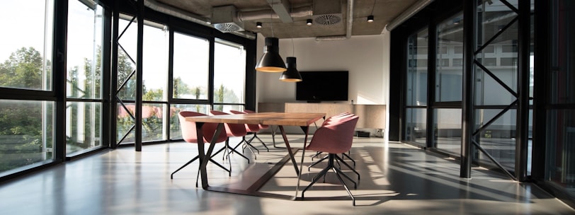 photo of dining table and chairs inside room