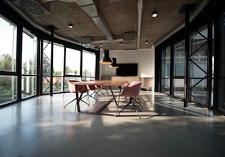 photo of dining table and chairs inside room