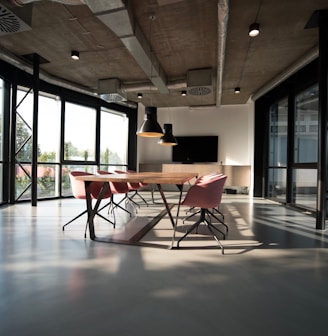 photo of dining table and chairs inside room