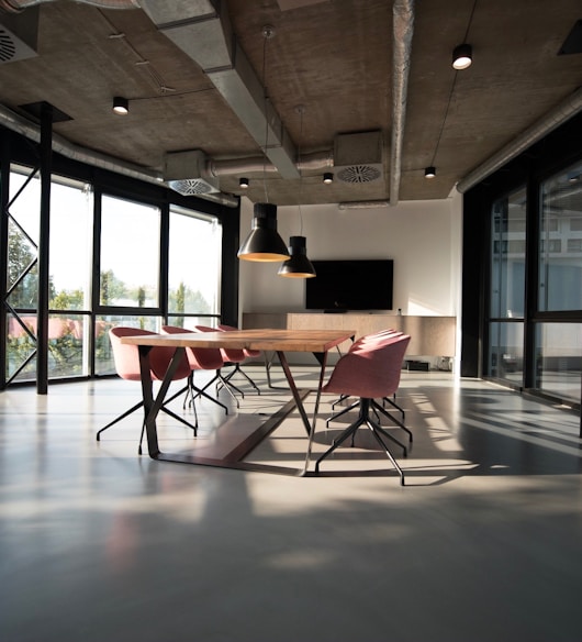 photo of dining table and chairs inside room