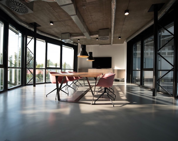 photo of dining table and chairs inside room