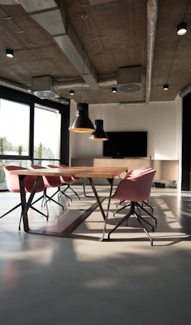 photo of dining table and chairs inside room