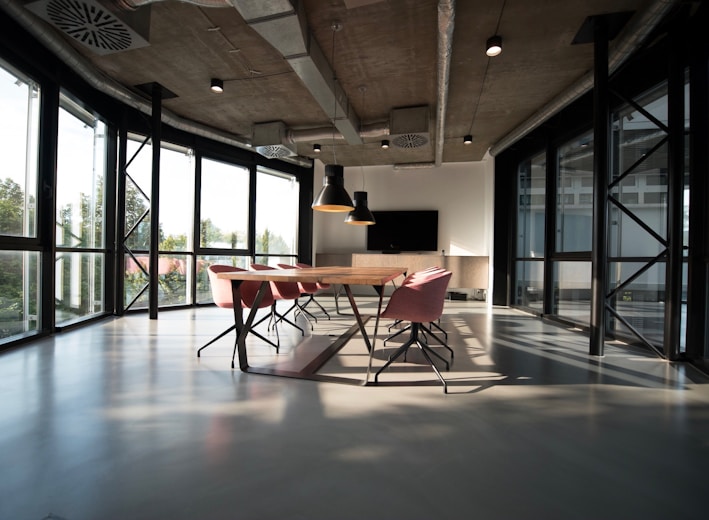 photo of dining table and chairs inside room