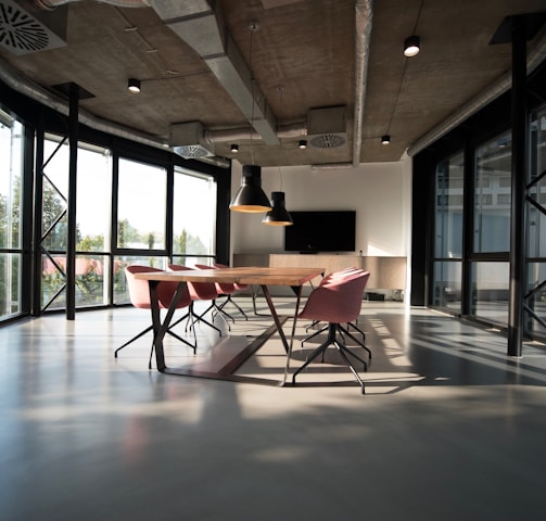 photo of dining table and chairs inside room