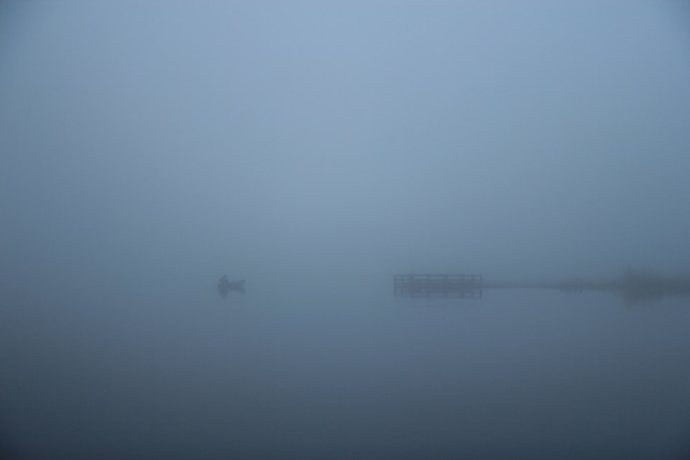 white and black building on body of water