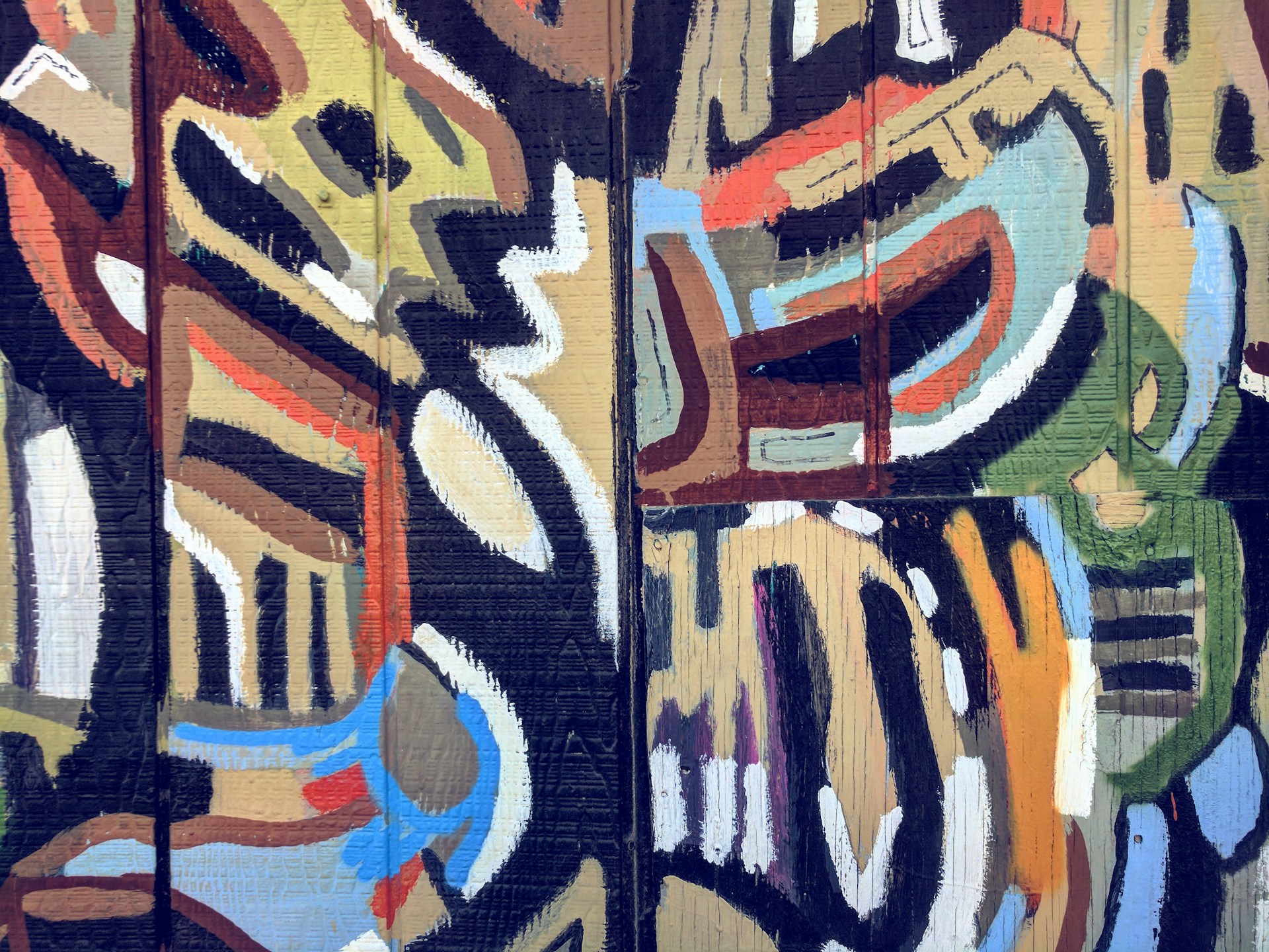An abstract artwork composed of bold, swirling patterns and shapes overlapping each other. The composition features a combination of dark and light colors, with notable hues of black, white, brown, blue, and olive green. The painting technique appears to involve thick brushstrokes or a textured application, adding depth to the design.
