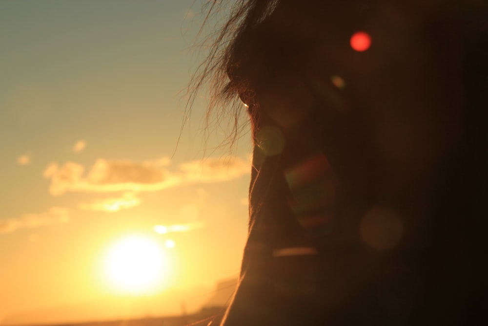 silhouette of woman during sunset