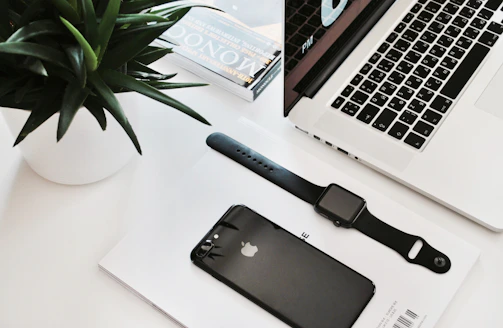 An inviting workspace featuring elegant office accessories and a fitness tracker on the desk.