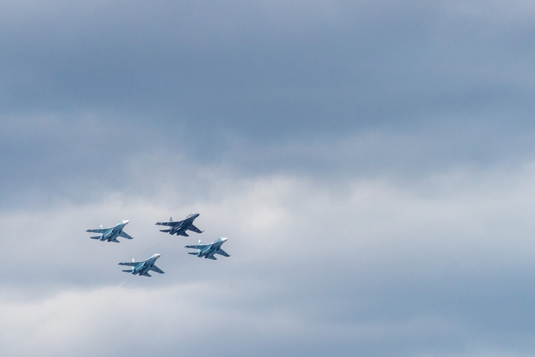 closeup photo of four fighting planes,