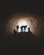 photo of people in cave