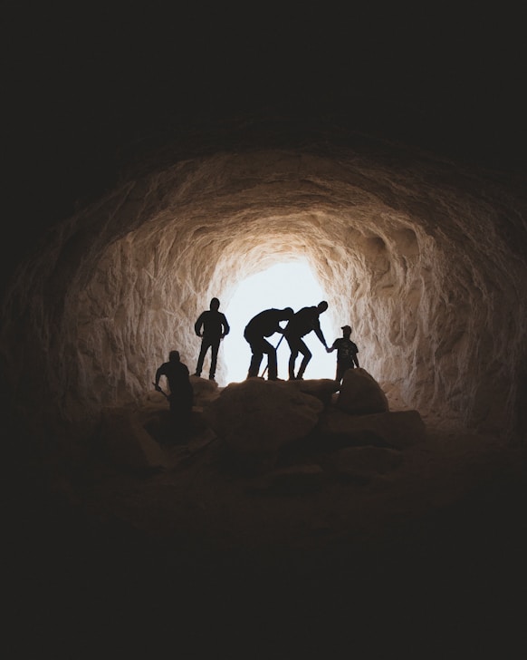 photo of people in cave