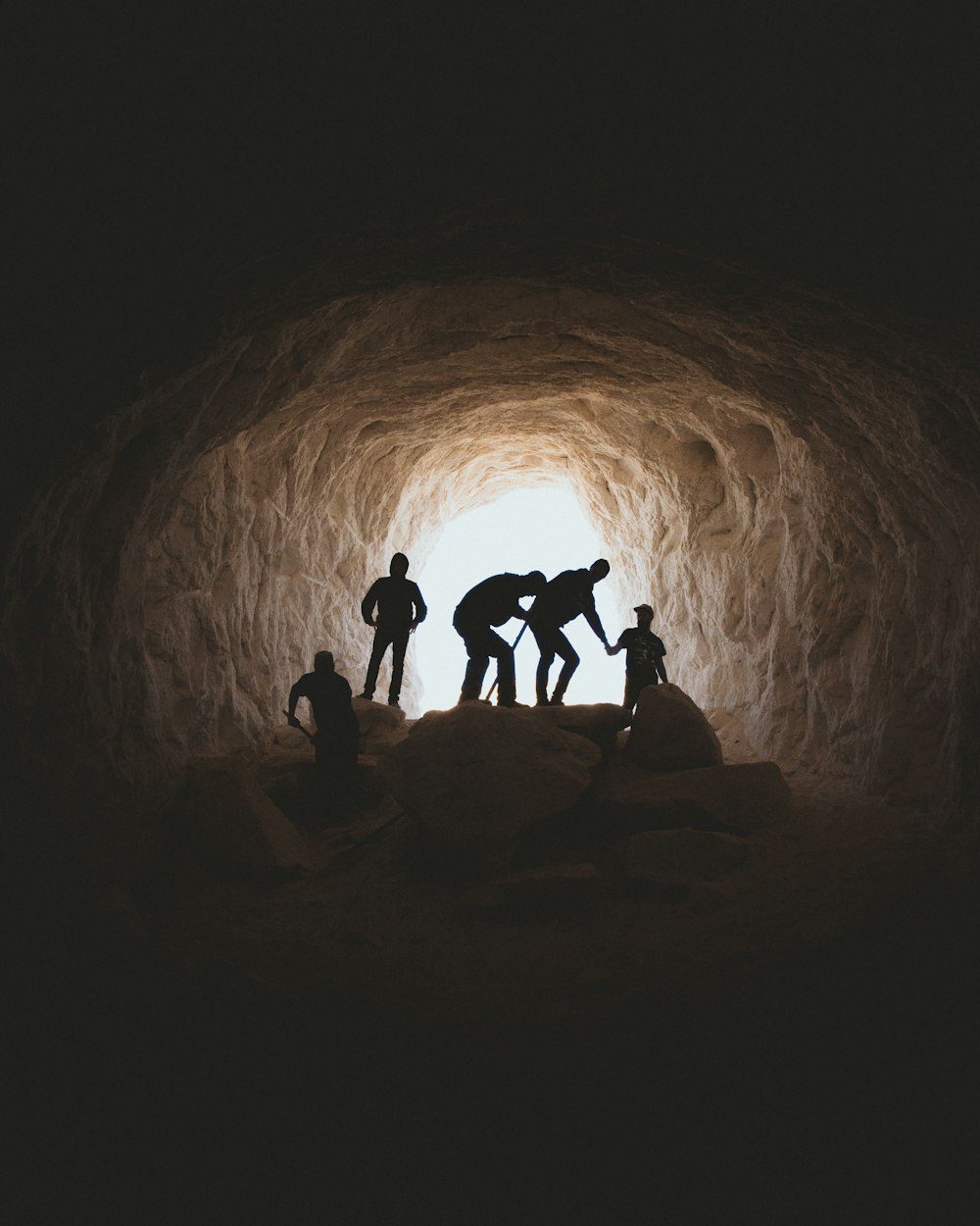 photo of people in cave
