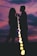 A happy couple enjoying a sunset together, symbolizing love and connection.