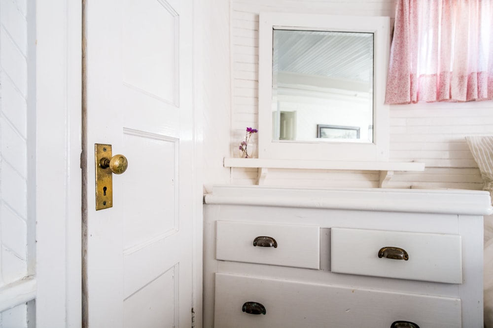 white wooden door near wooden dresser