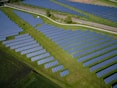 aerial photography of grass field with blue solar panels