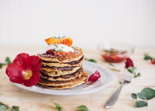 pancakes on plate beside fork