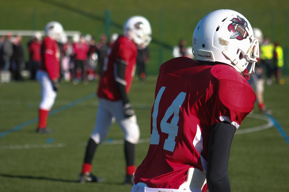 selective focus photography of American football 14 player